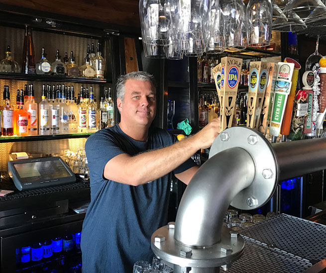 Bartender shaking a cocktail at the No Name Saloon